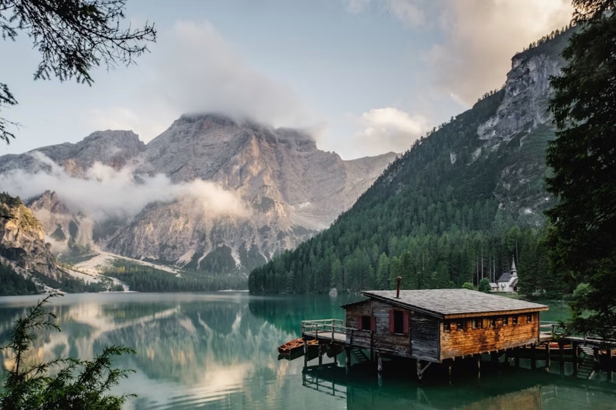 Mountain lake with a wooden boathouse