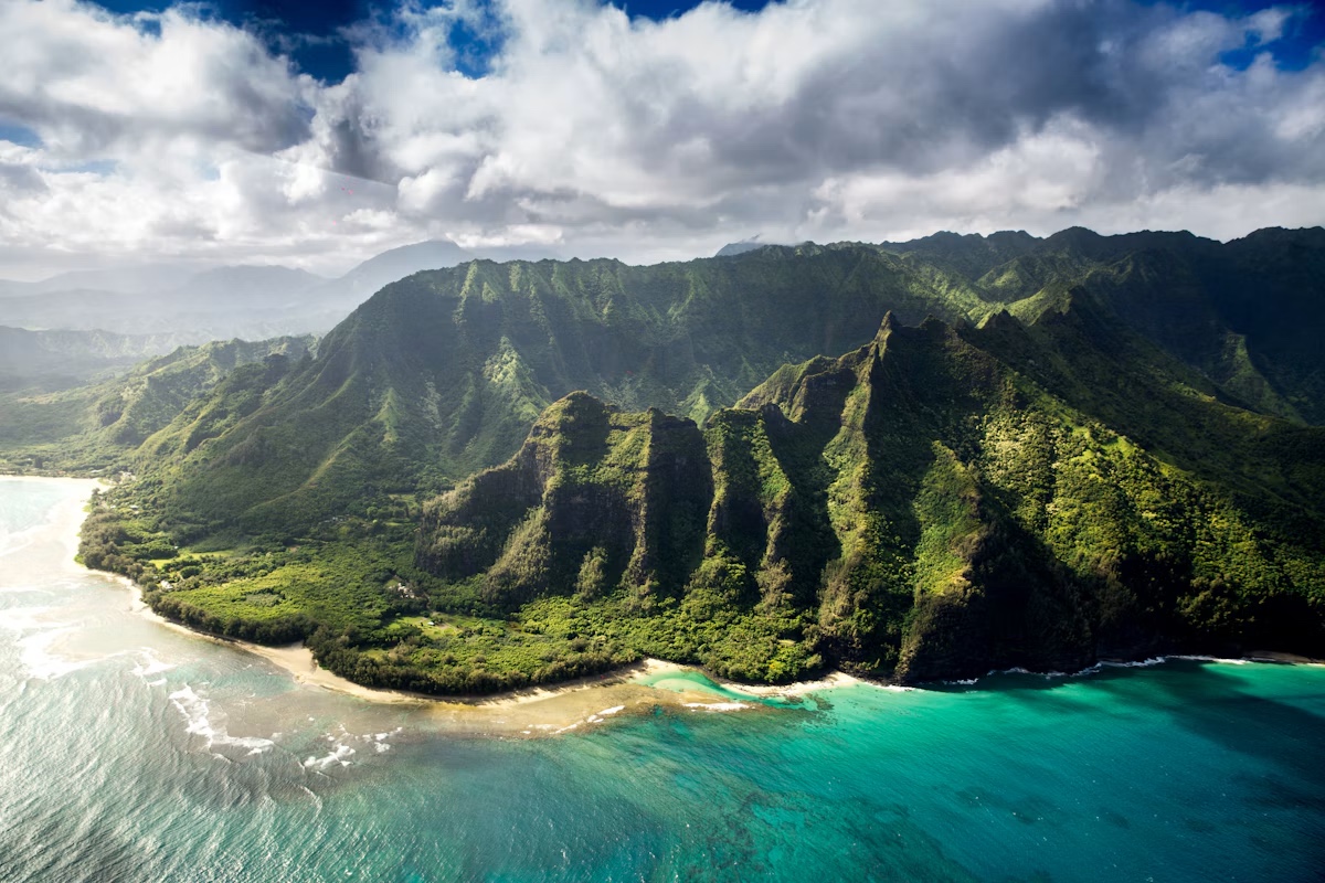 Aerial view of the green ridges of Kauai’s Nā Pali Coast
