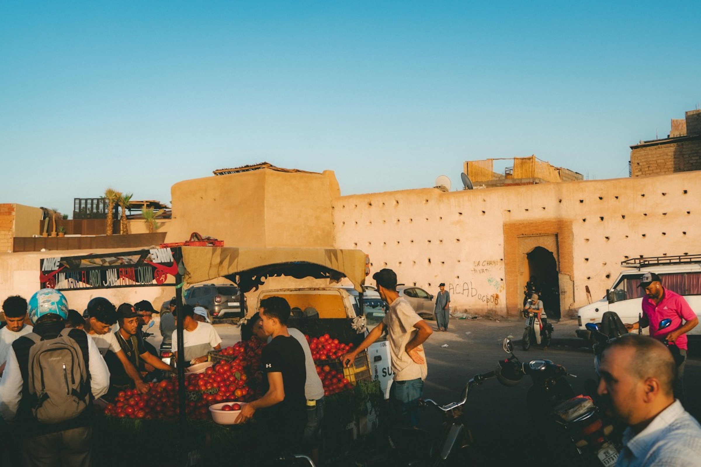 Locals gathered at a market stall outside the old city walls