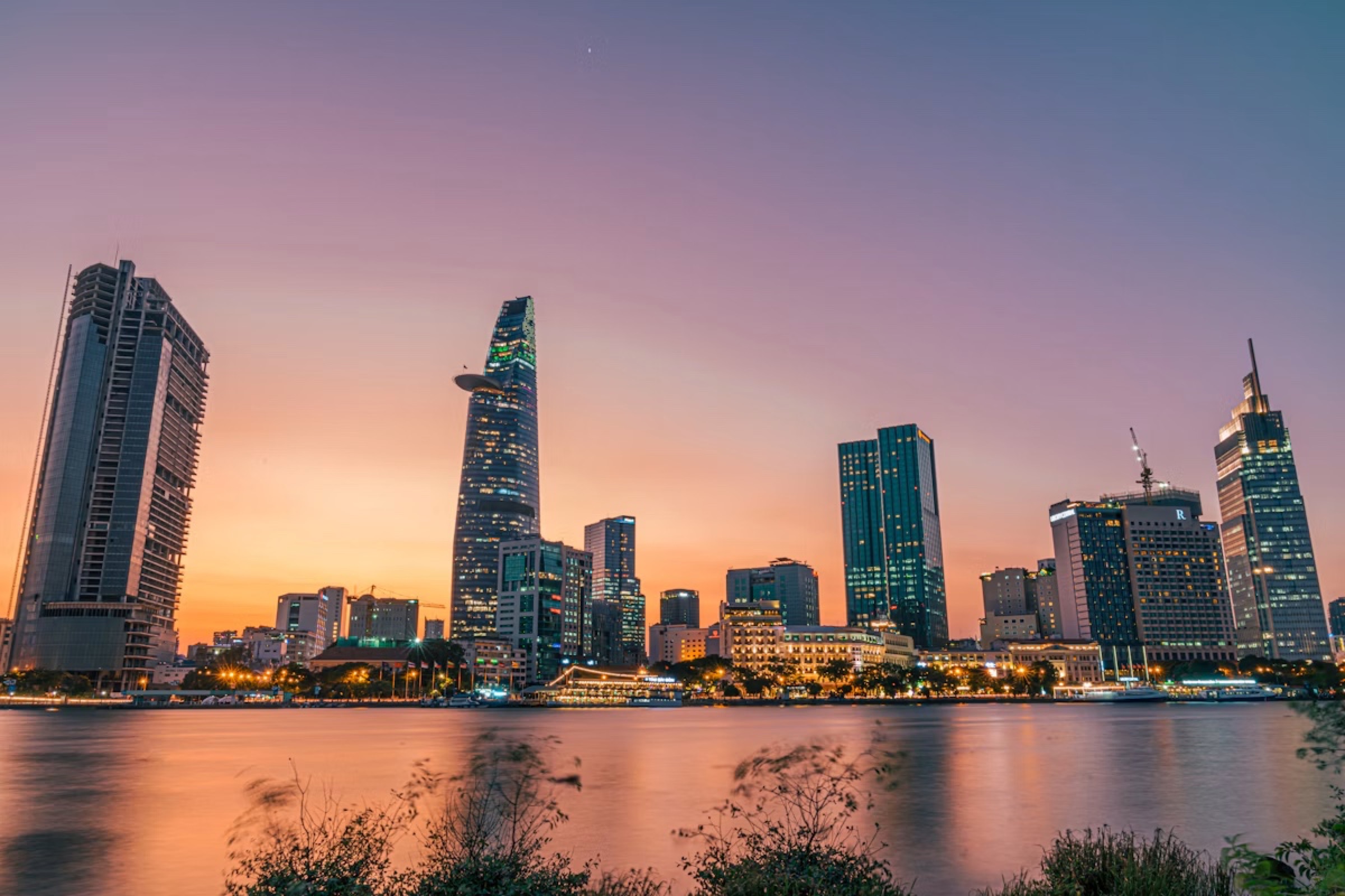 The Ho Chi Minh City skyline across the river at dusk