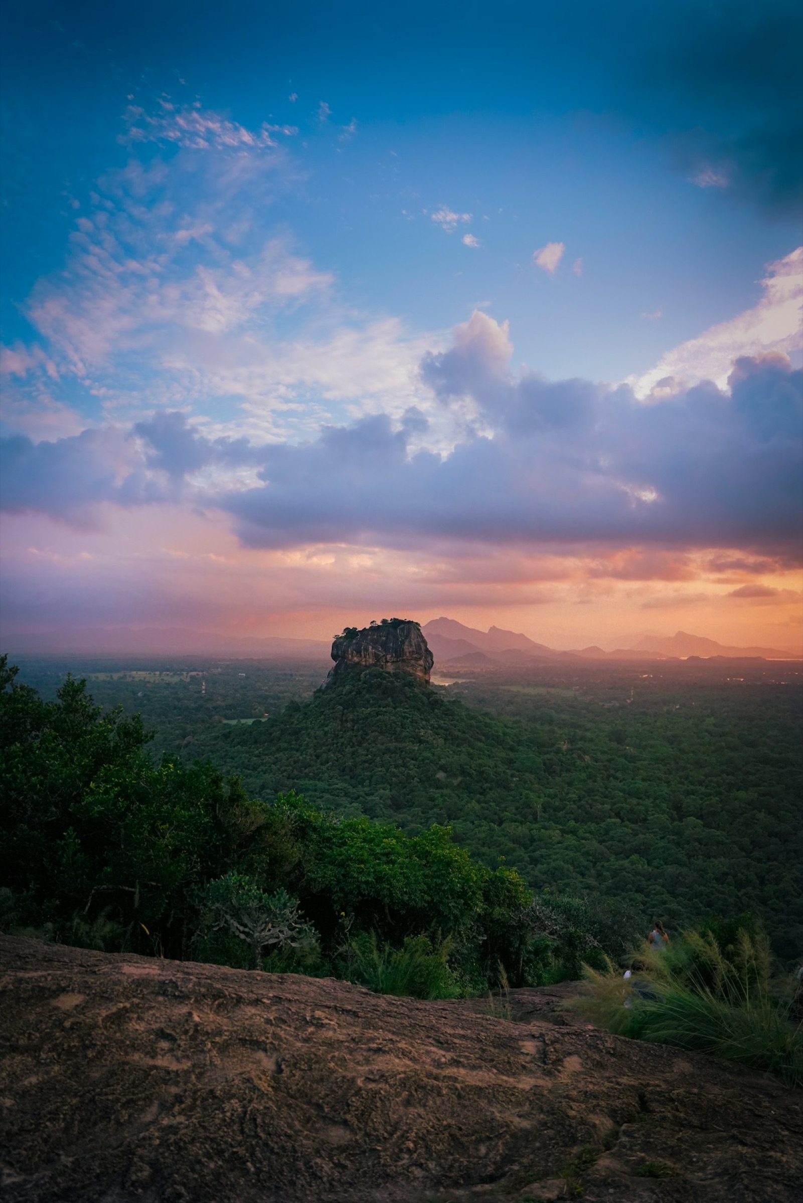 Sigiriya Rock Fortress above the jungle at dusk