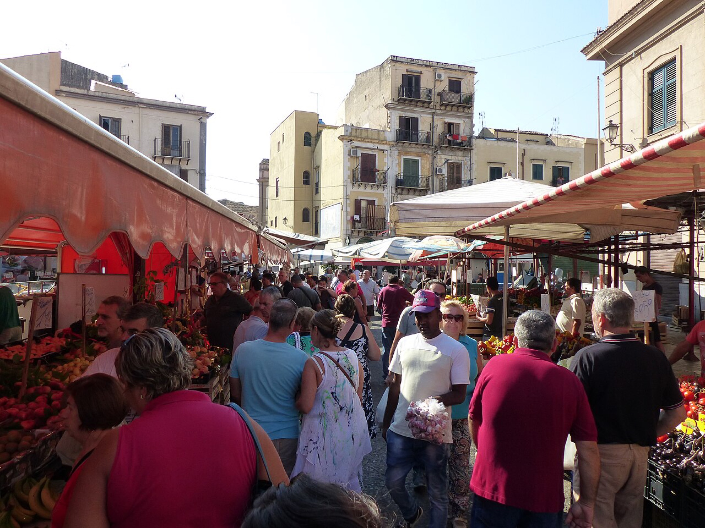 Shoppers in a busy Sicilian street market