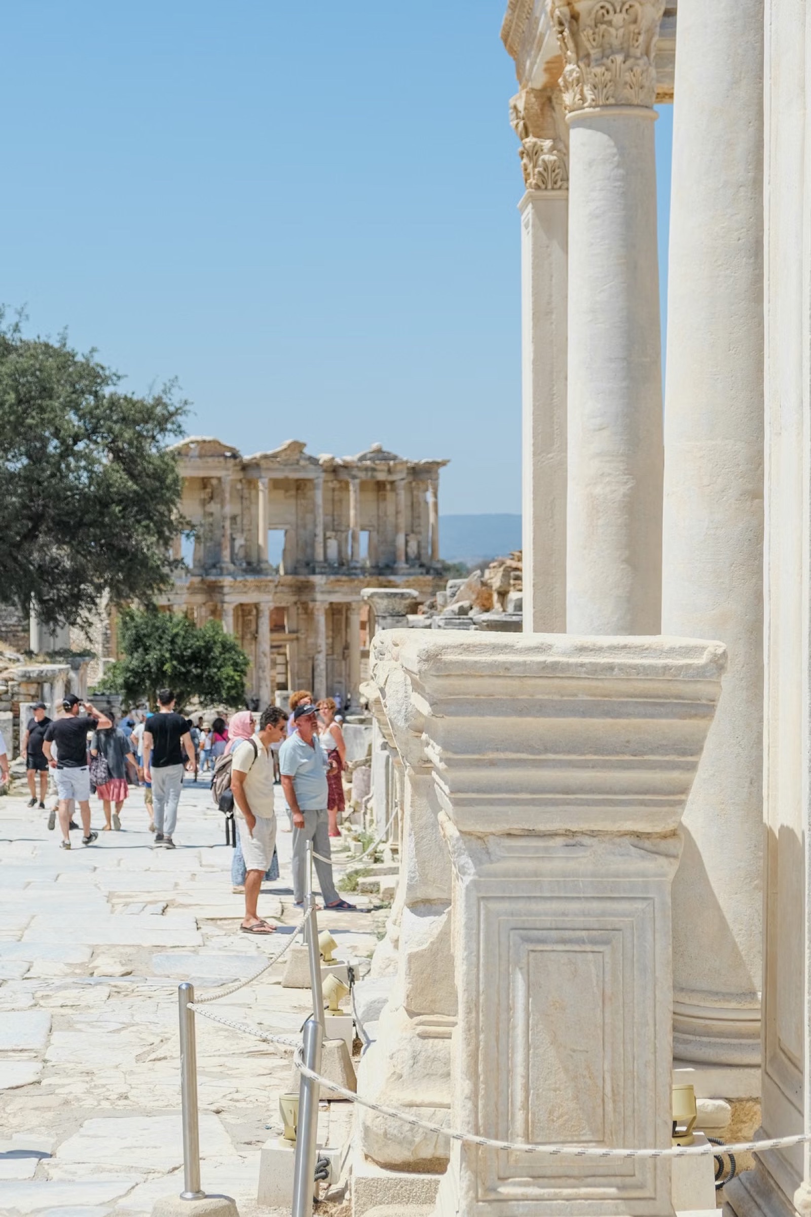 Visitors walking towards the Library of Celsus in Ephesus