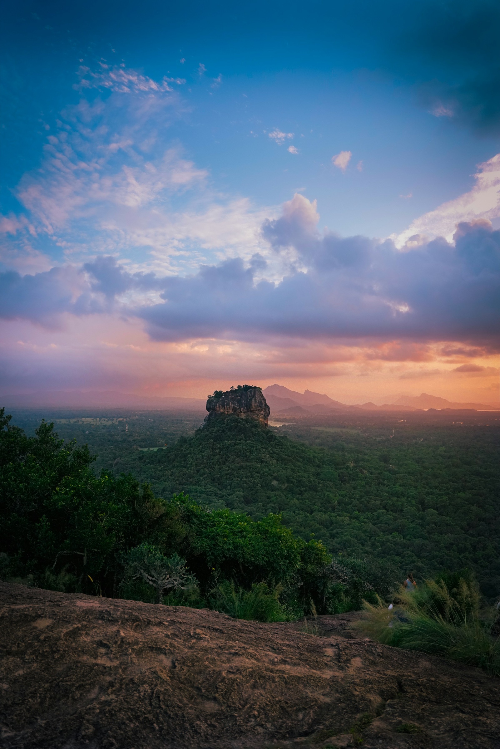 Sigiriya Rock rising above the forest at sunset