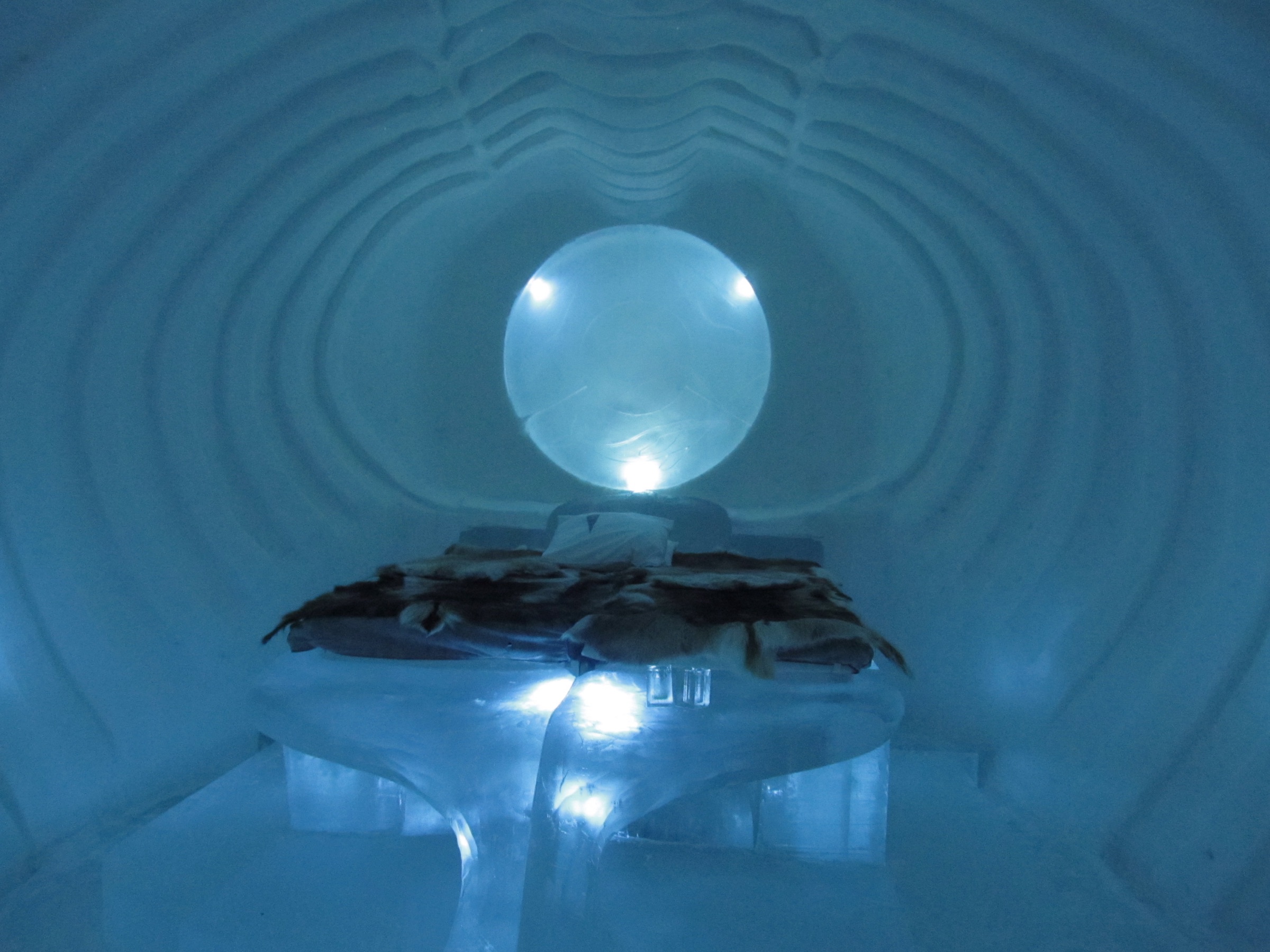 A glowing ice sculpture inside the ICEHOTEL