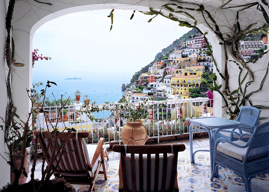 A terrace framed by vines looking over Positano