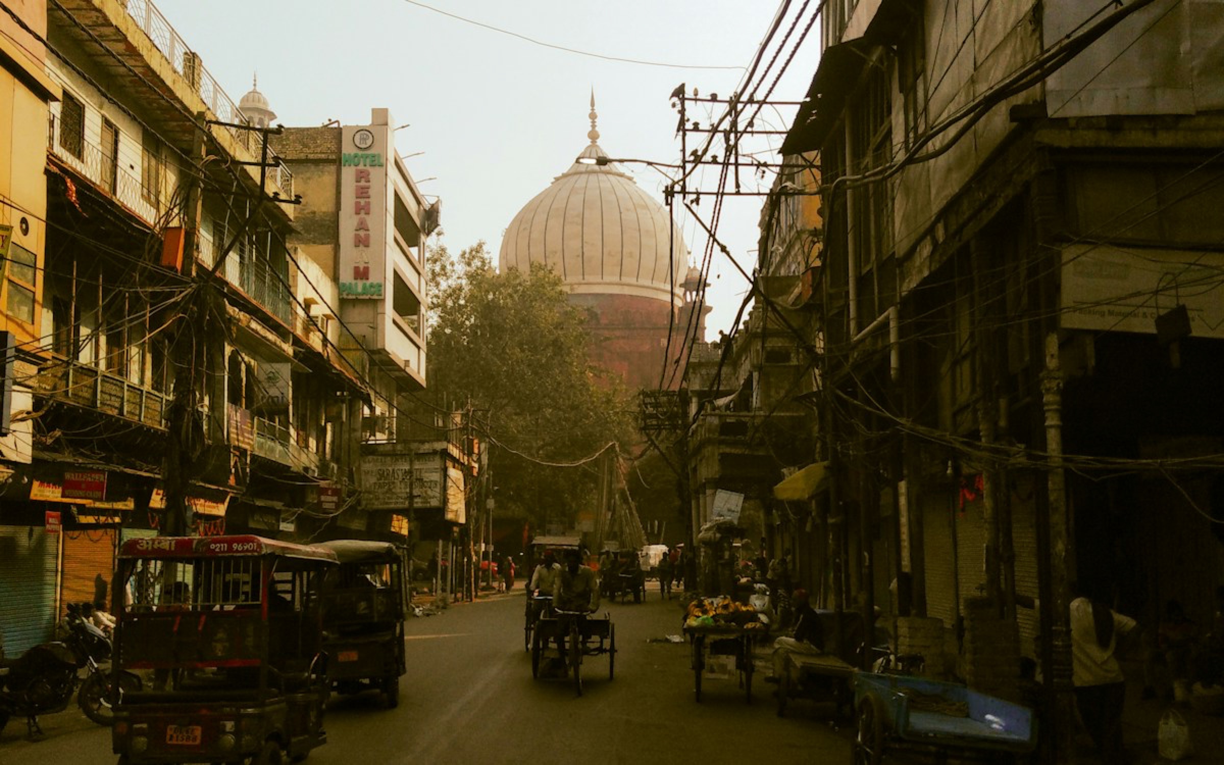 A busy street in Old Delhi at dusk