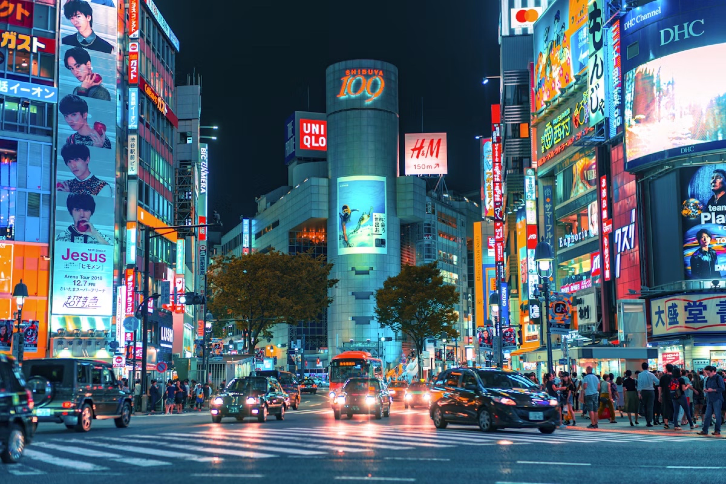 Neon signs and traffic in Shibuya at night
