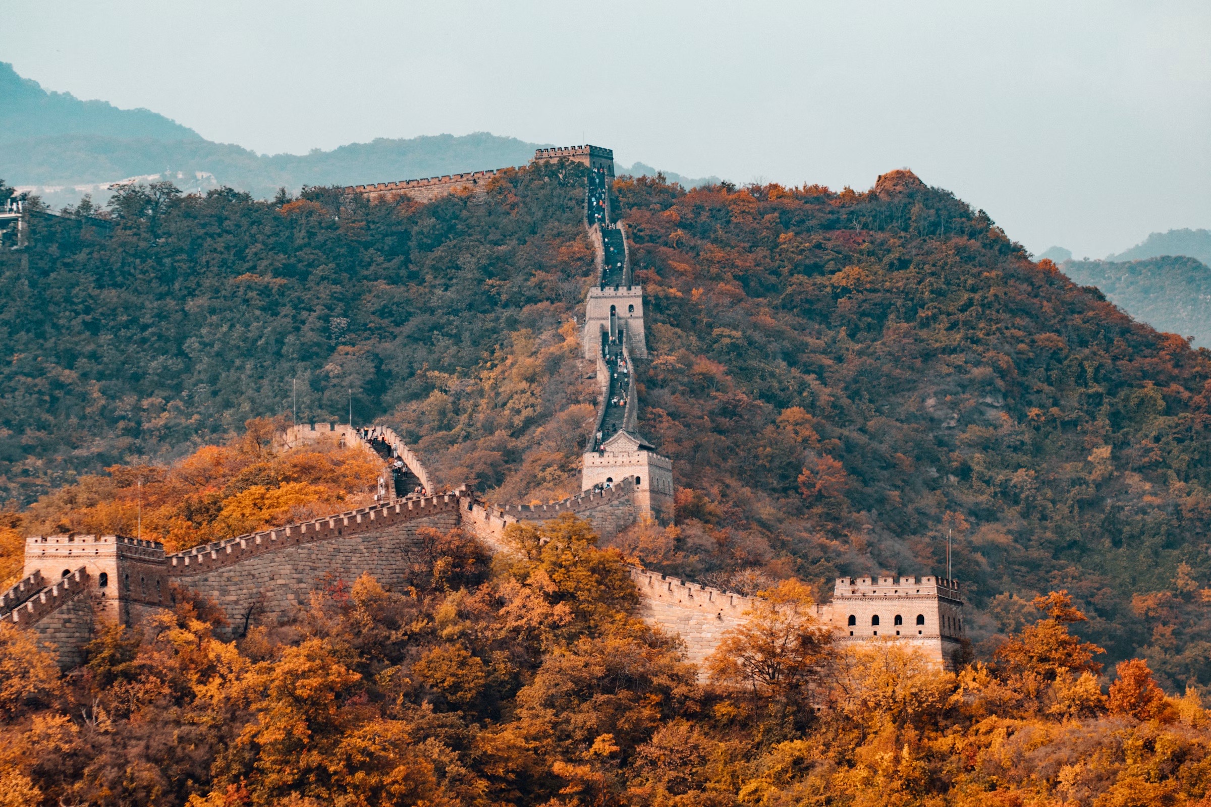 The Great Wall winding over autumn hills