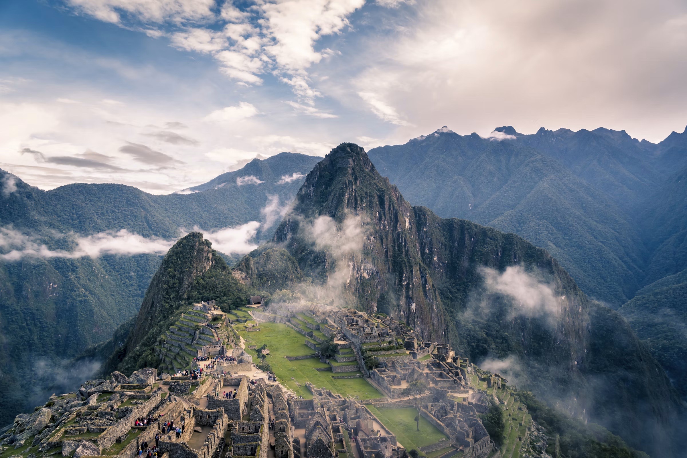 Machu Picchu beneath misty Andean peaks