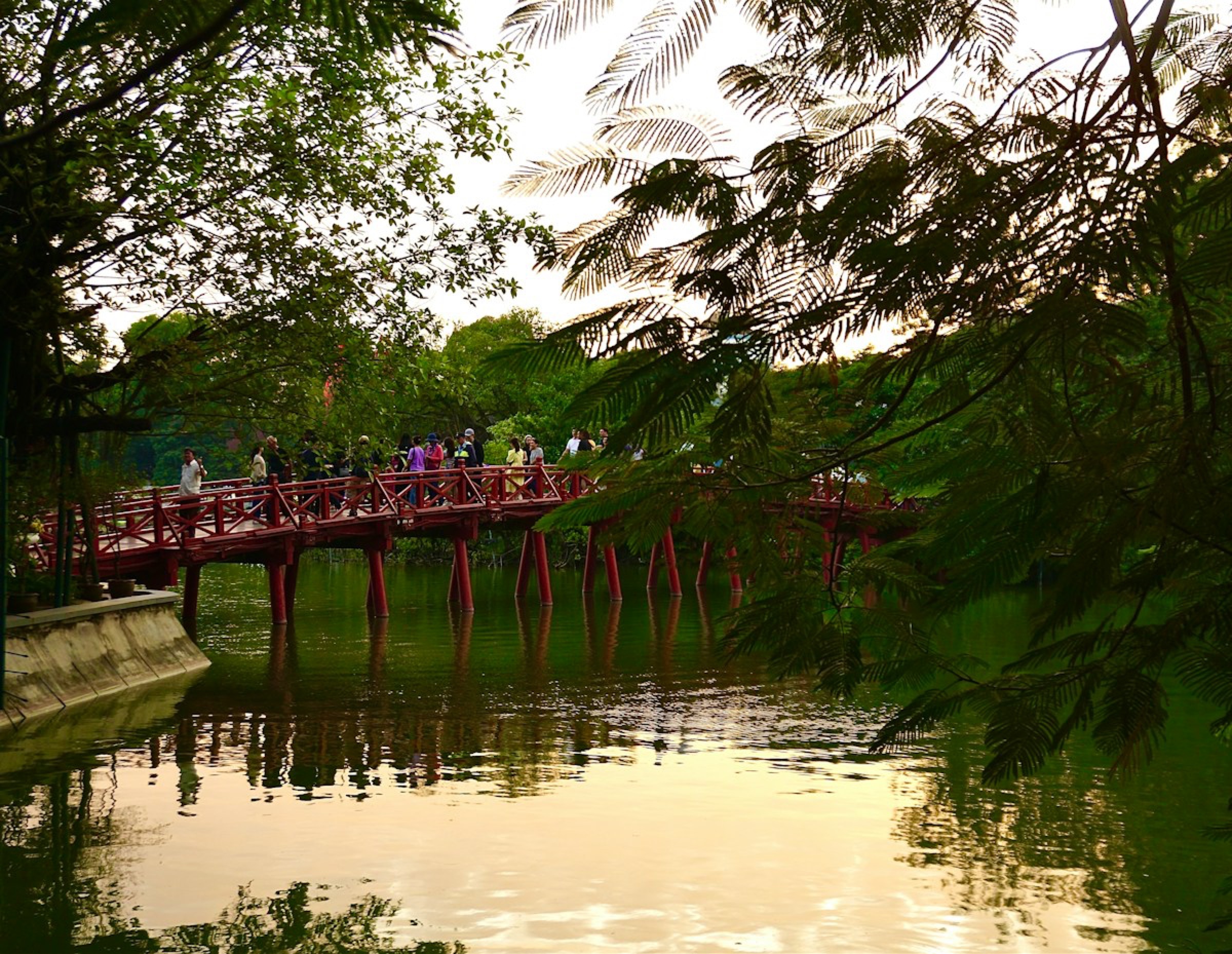 The red Huc Bridge over Hoan Kiem Lake in Hanoi