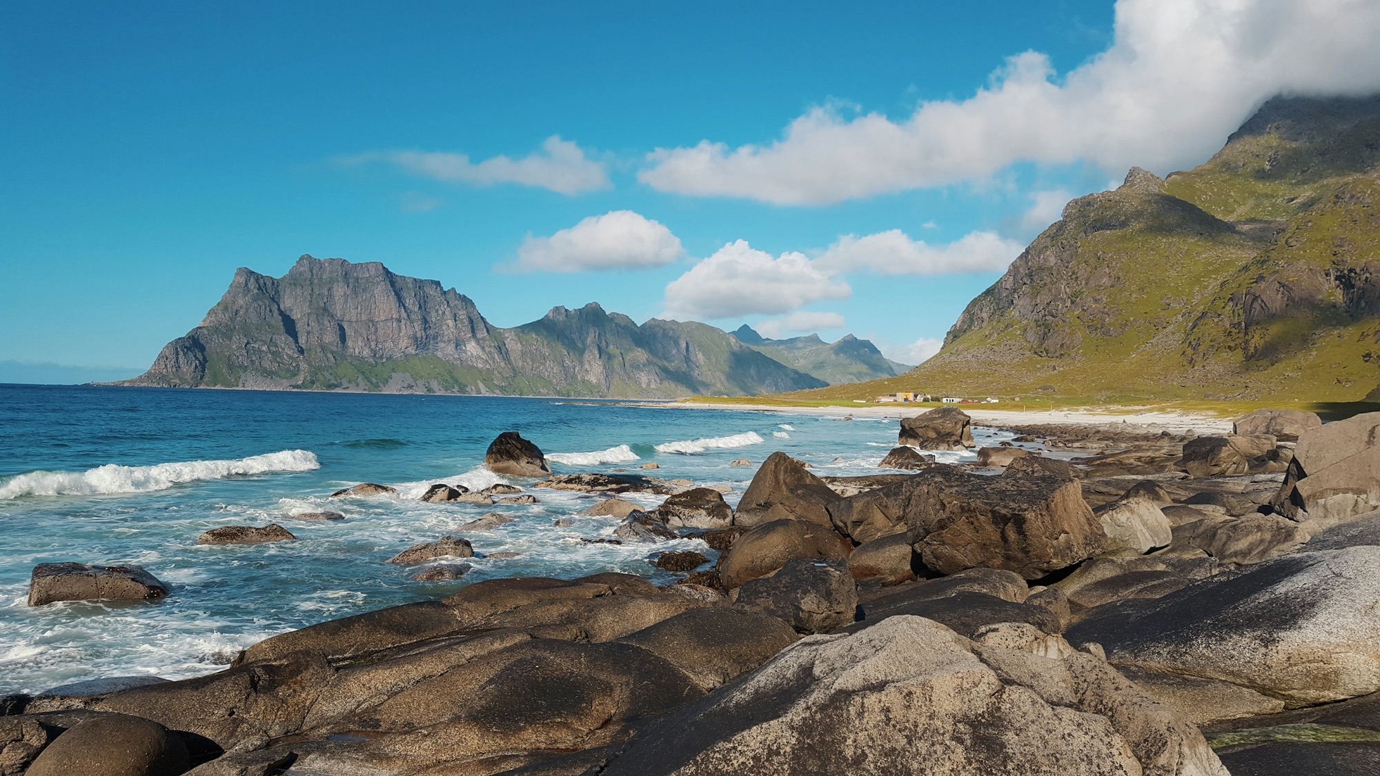Rugged mountains above a rocky shore in the Lofoten Islands